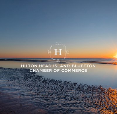 sun set visible on ocean horizon against dark blue sky. chamber logo on top of image