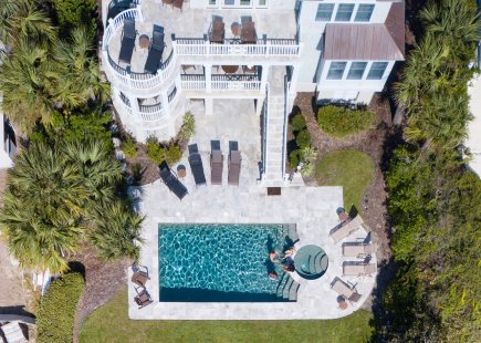 aerial view of pool and surrounding property
