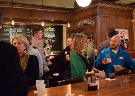 People in a bar chatting and enjoying drinks