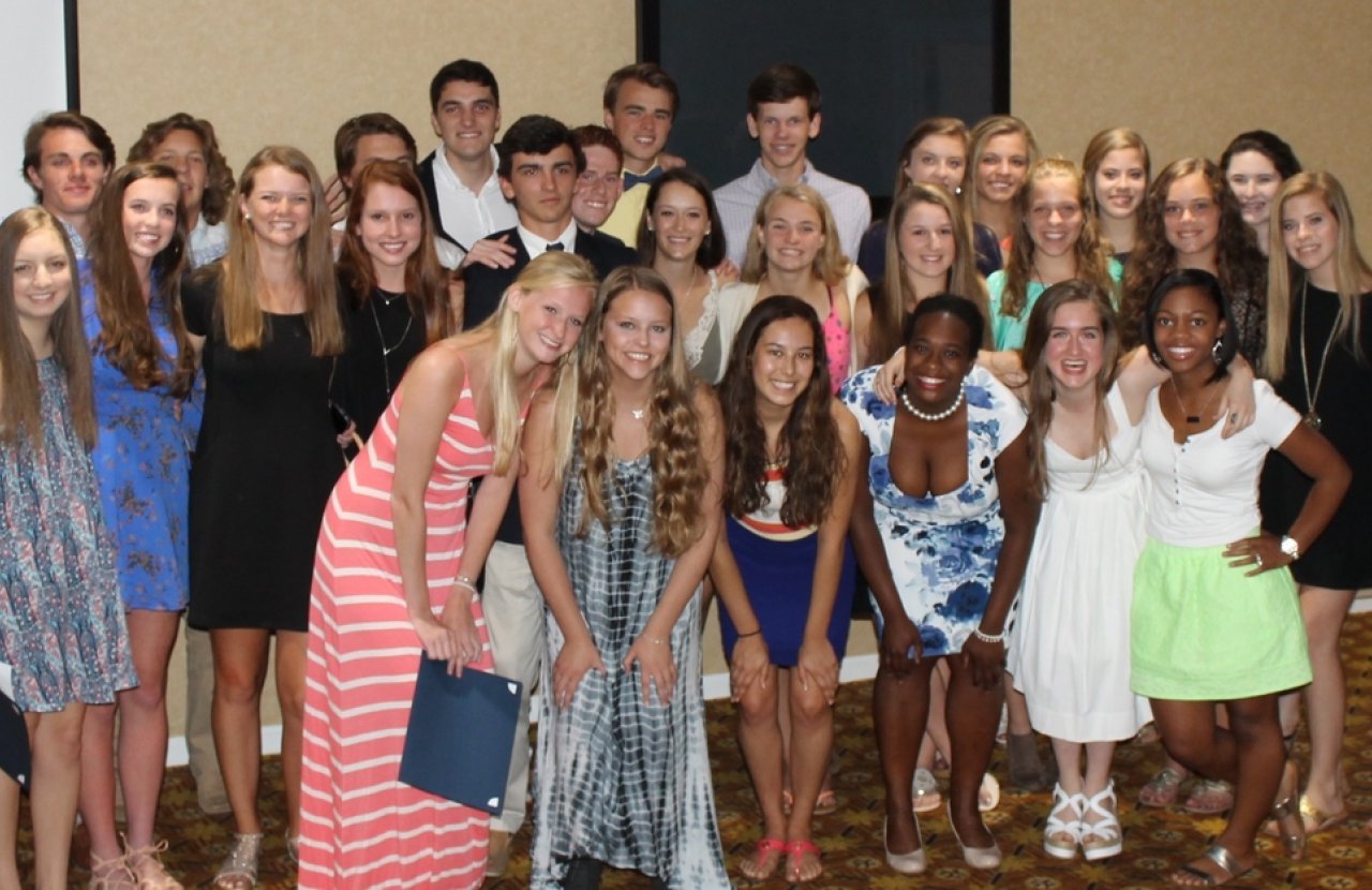 Large group of young adults posing for photo