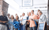 A group of people at a ribbon cutting ceremony